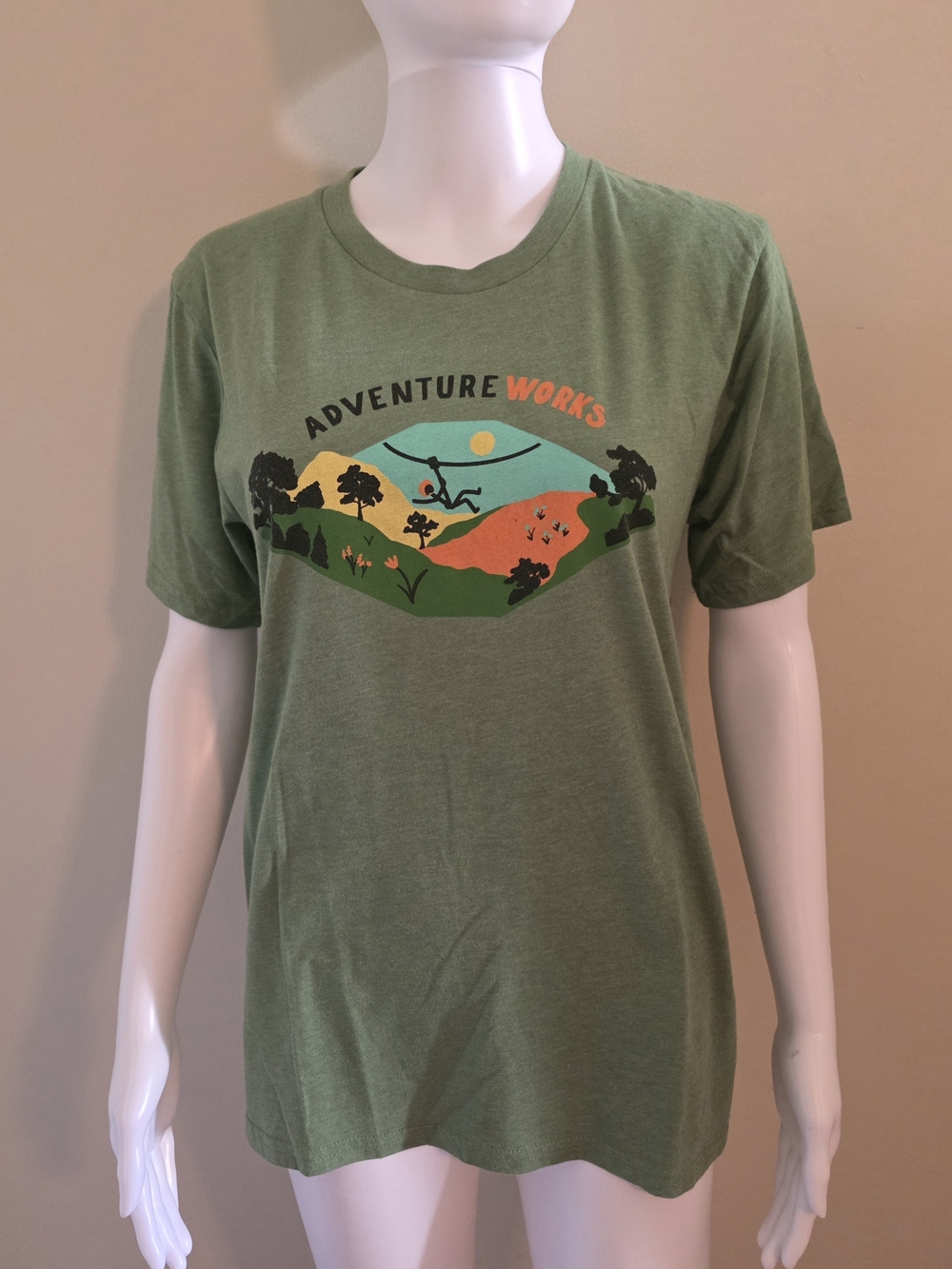 Royal Apparel Adventure Works Woman's Size Med Green Graphic Tee Made In USA.